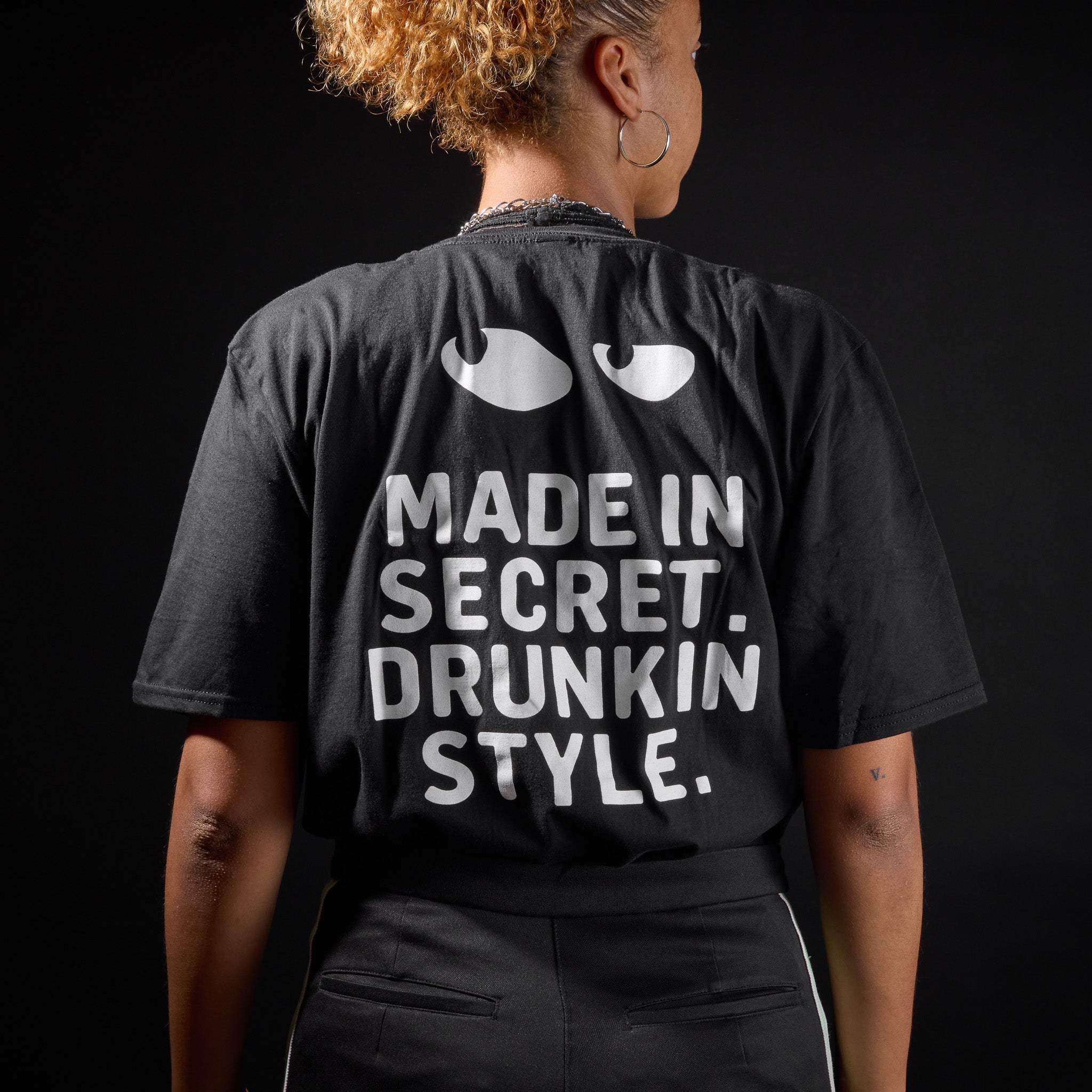 SLY DOG T-Shirt 2.0 – Back View of Model Wearing Classic Black Cotton Tee