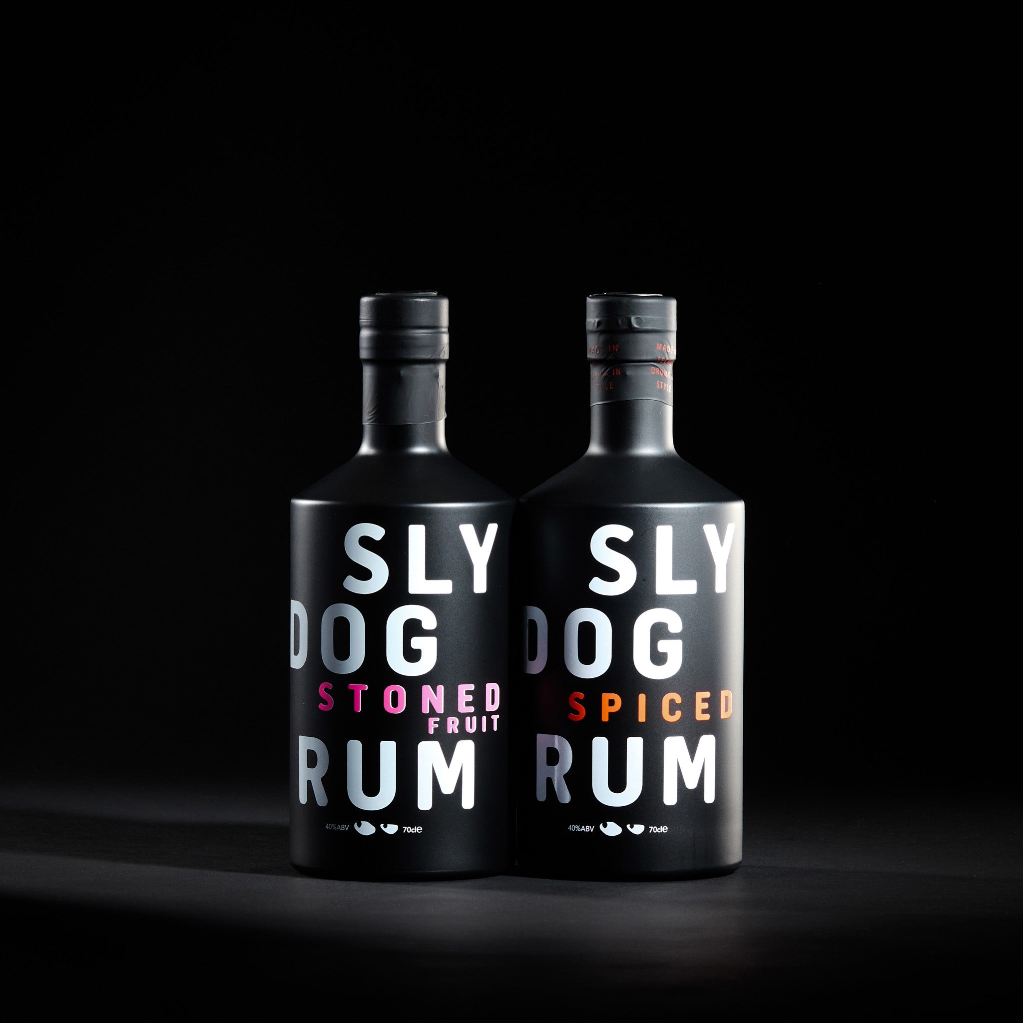 The Duo – Front View of SLY DOG Spiced Rum and Stoned Fruit Rum 70cl Bottles